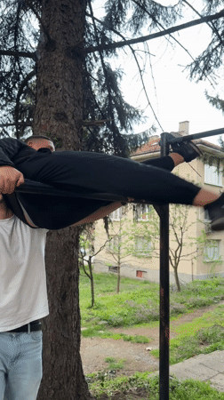 Two men interact outdoors in Berkovitsa, Bulgaria