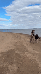 Woman, child enjoy beach outing in Noviy, Russia