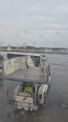 Rainy evening airport operations documented at Luxembourg Findel