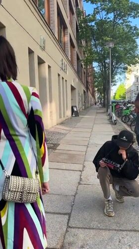 Street photo shoot observed in Berlin featuring colorful coat