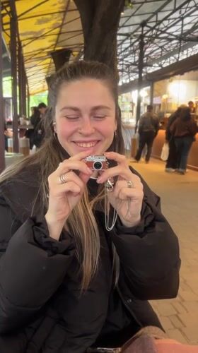 Young people gather at outdoor cafe in Odesa