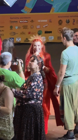 Theatrical stage performance in Moscow, red dress and gold crown