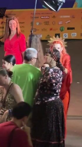 Theatrical stage performance in Moscow, red dress and gold crown