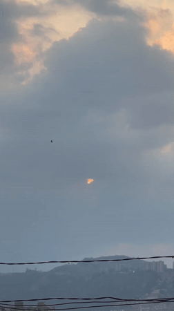 Dramatic sunset breaks through storm clouds over Caracas