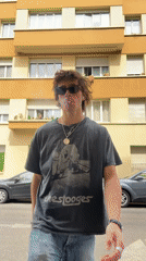 Young man smokes cigarette on Paris street