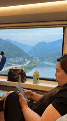 Train passengers use phones during journey through Jiange County