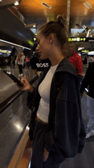 Evening travelers navigate Doha airport with luxury displays