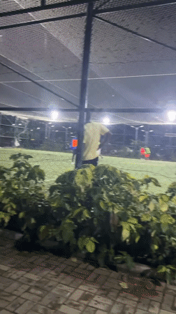 Nighttime soccer match played on enclosed field in Gura Top