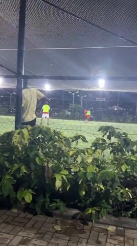 Nighttime soccer match played on enclosed field in Gura Top