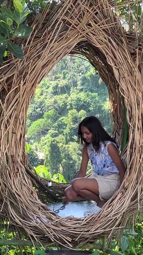 Tourists enjoy waterfall attractions and resorts in Sukawati, Bali