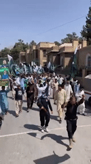 Pakistani flag procession draws large crowd of men