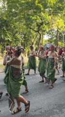Traditional Balinese cultural procession draws participants in elaborate ceremonial attire