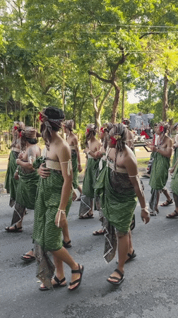 Traditional Balinese cultural procession draws participants in elaborate ceremonial attire