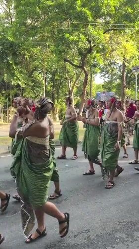 Traditional Balinese cultural procession draws participants in elaborate ceremonial attire