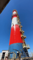Rope-suspended maintenance work on a painted industrial tower in Bulgaria