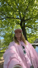 Woman documents spring walk through blooming Saint Petersburg parks