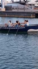 Rowing crews and dragon boats active in harbor waters