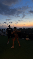 Woman trains boxing at sunset in North Kuta