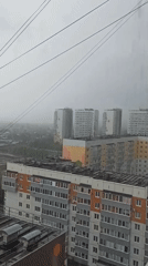 Morning rainfall observed across urban residential area, aircraft spotted