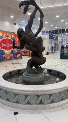 Morning shoppers document fountain statue at Yekaterinburg mall