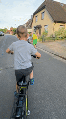 Family enjoys afternoon rollerblading and cycling in Fredenbeck, Germany