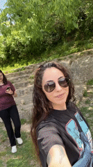 Women film smartphone video in sunny Vilafranca del Penedès