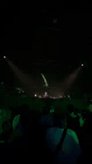 Nighttime crowd dances at Coachella music festival in California