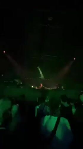 Nighttime crowd dances at Coachella music festival in California