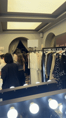 Video captures Paris dressing room with clothing racks and mirror