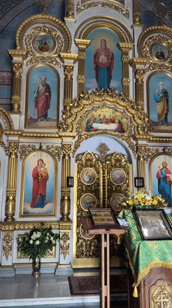 Golden iconostasis and bible captured in Kyiv church video