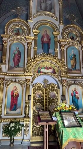 Golden iconostasis and bible captured in Kyiv church video