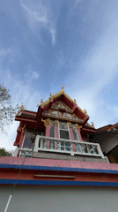Visitor documents Thai Buddhist temples with golden statues, ornate architecture