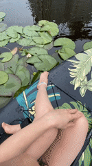 Paddleboarding through blooming water lilies on the Kama River