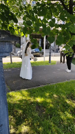 Wedding and summer blooms outside a Kemerovo apartment block