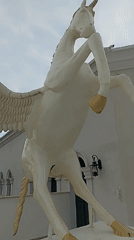 Tourist documents Pegasus statue and coastal scenes in Yenişehir