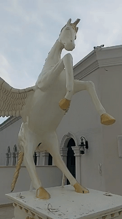 Tourist documents Pegasus statue and coastal scenes in Yenişehir