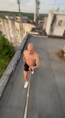 Man performs rooftop stunts during sunset in Pleven, Bulgaria