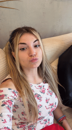 Woman rests on papers with phone numbers in Budva