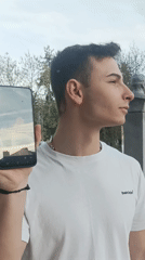 Young man with smartphone observed in Reselets, Bulgaria