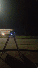 Evening traffic documented on illuminated street in Mbribit, Nigeria