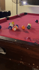 Pool player sinks two balls at Nigerian bar
