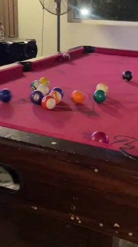 Pool player sinks two balls at Nigerian bar