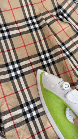 Manchester residents document afternoon ironing and organized indoor workspace