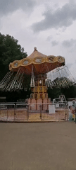 Visitors document amusement rides at Moscow's Sokolniki Park