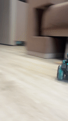 Child plays with remote-controlled toys during morning breakfast time