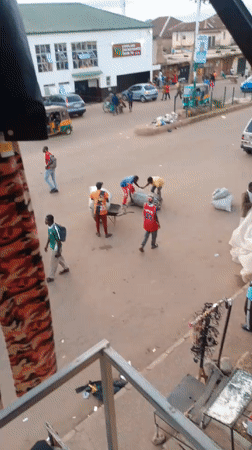 Bukuru market street buzzing with goods, vehicles, and foot traffic
