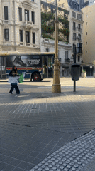 Woman carries protest sign about children in Buenos Aires