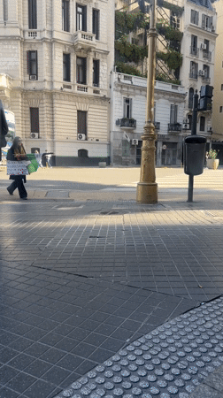 Woman carries protest sign about children in Buenos Aires