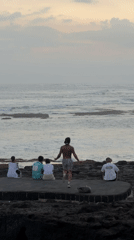 Bali shoreline moments: group gathering and beachside training