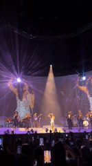Female singer performs concert with projection screens in London
